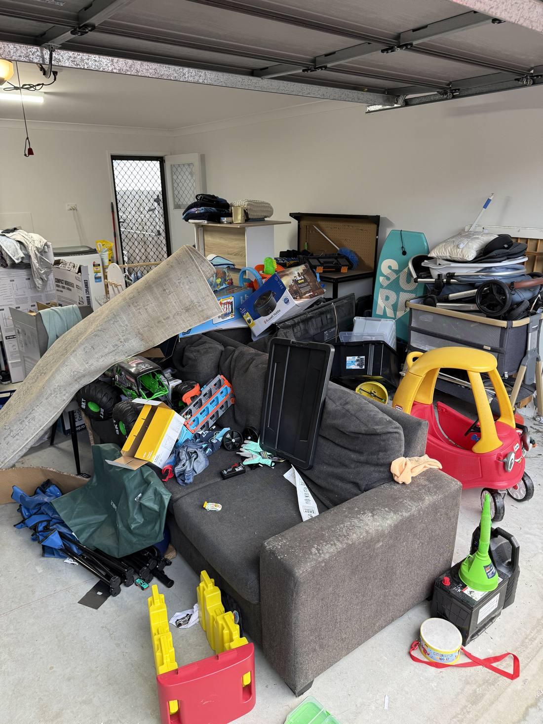 Cluttered garage before clean-out